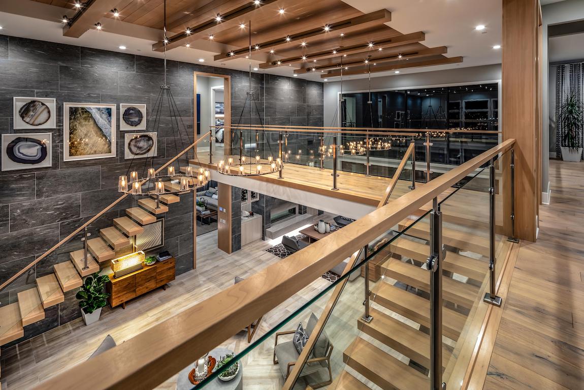 Luxury great room with modern floating stairs and open design