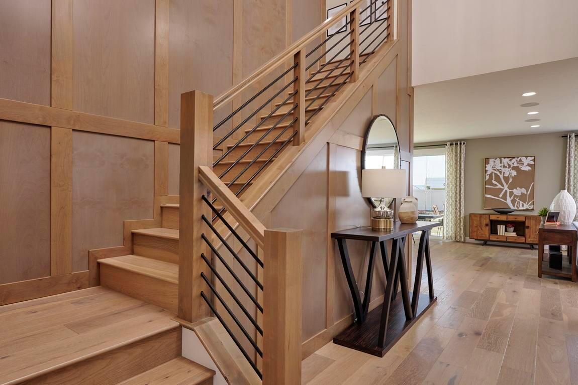 Contemporary great room with modern staircase and open layout