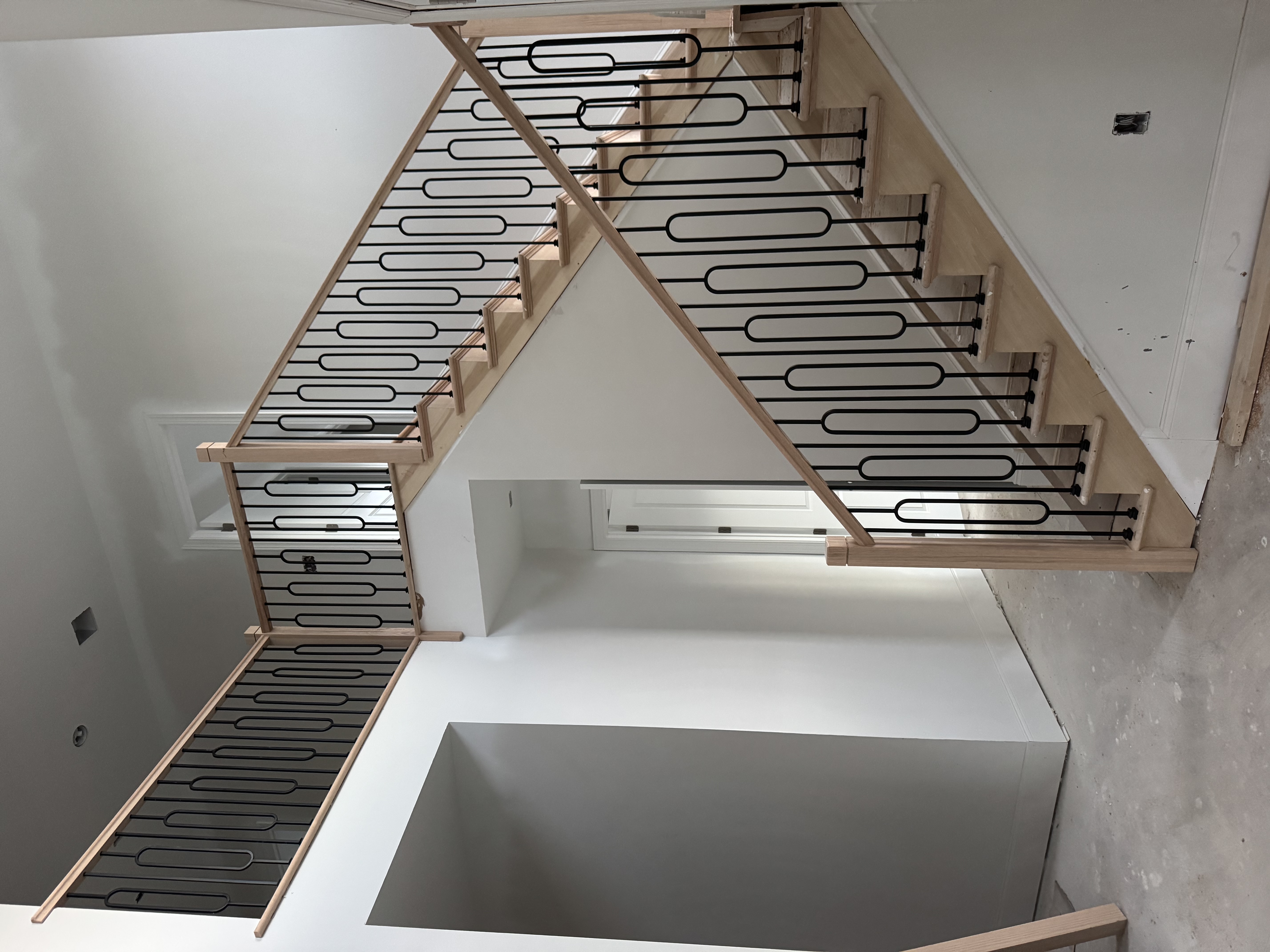 Contemporary staircase with sleek black railings