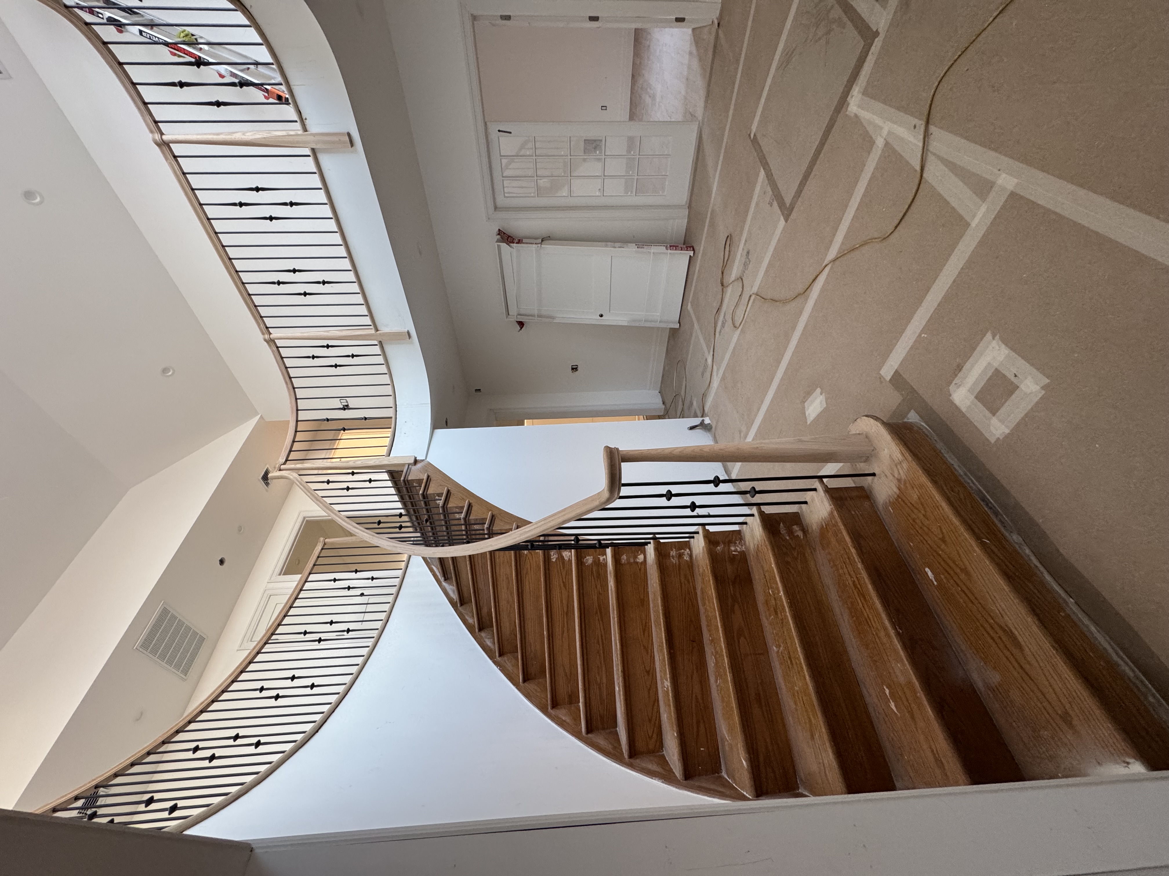 Stunning curved staircase with architectural design